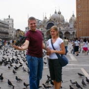 Feeding pigeons in Venice's St. Mark's Square during the 2007 Italy trip, with the Basilica and Campanile visible in the background